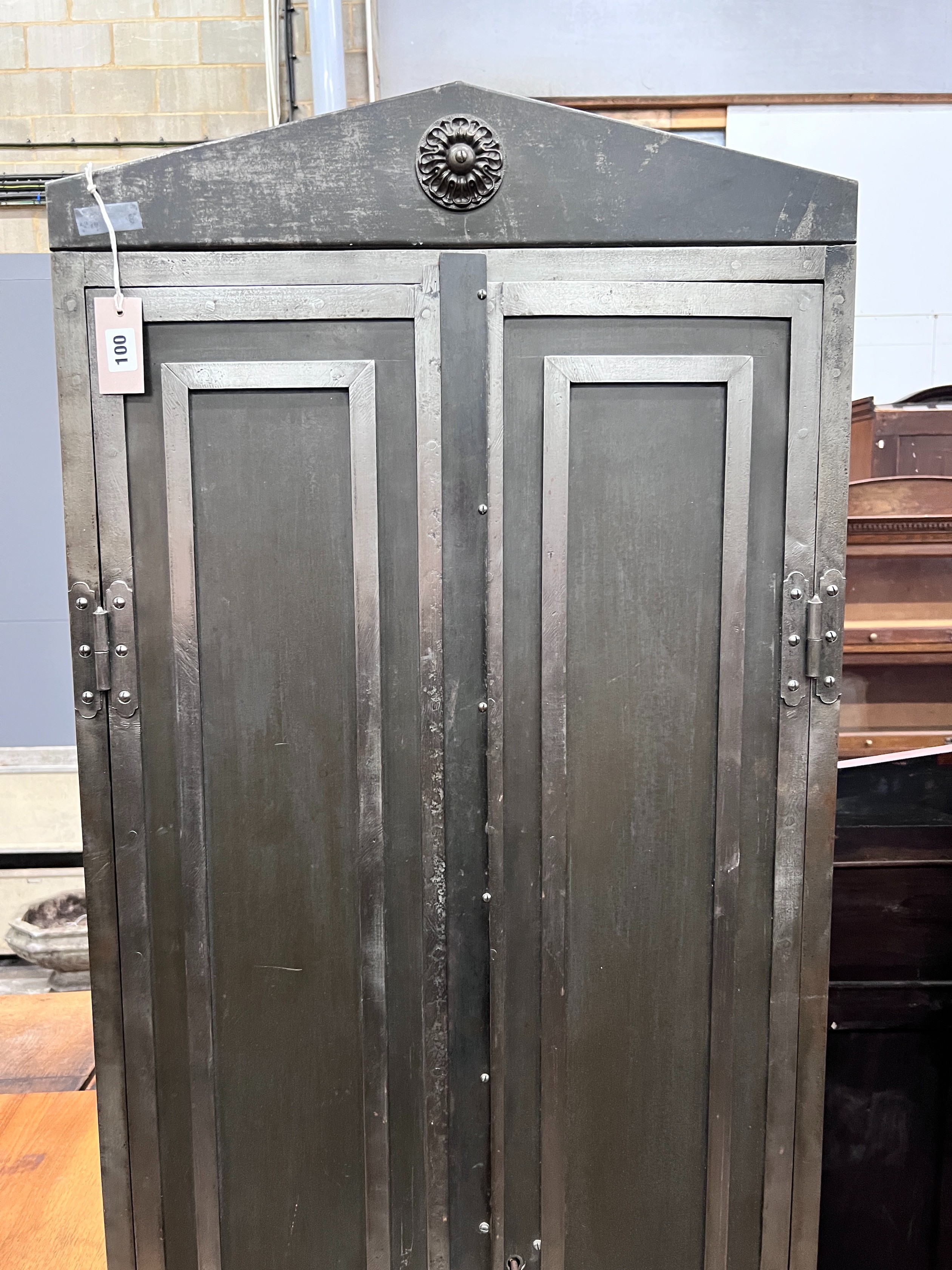 An Indian style metal two door cupboard, width 60cm, depth 41cm, height 186cm *Please note the sale commences at 9am.